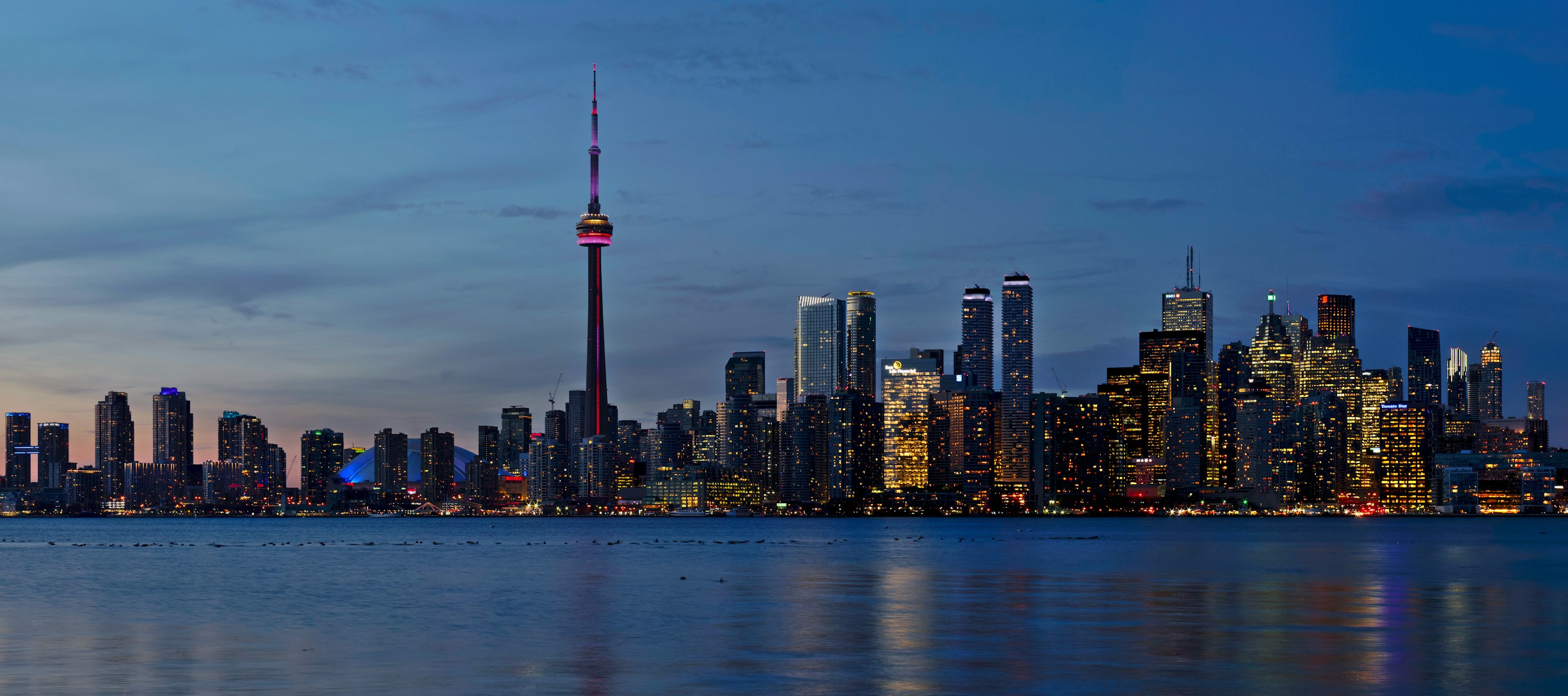 Toronto's illuminated skyline at dusk